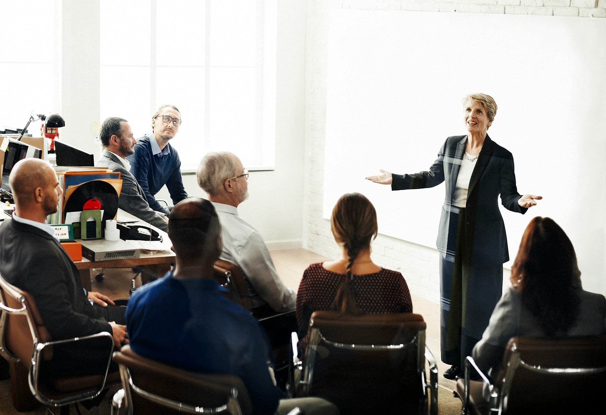 A speaker presenting to a seated audience